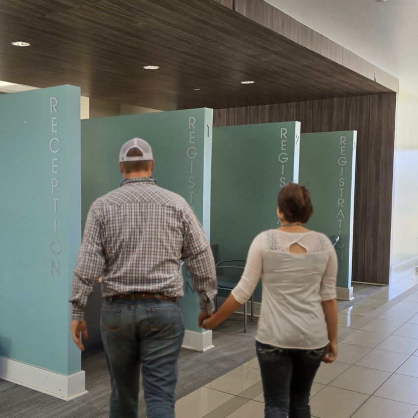Image of a couple holding hands about to check in at Sierra Vista Hospital
