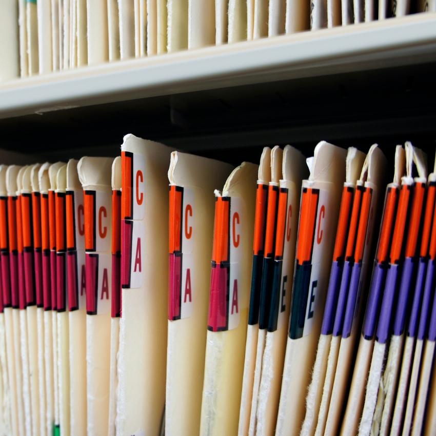 Image of multiple medical records filed away